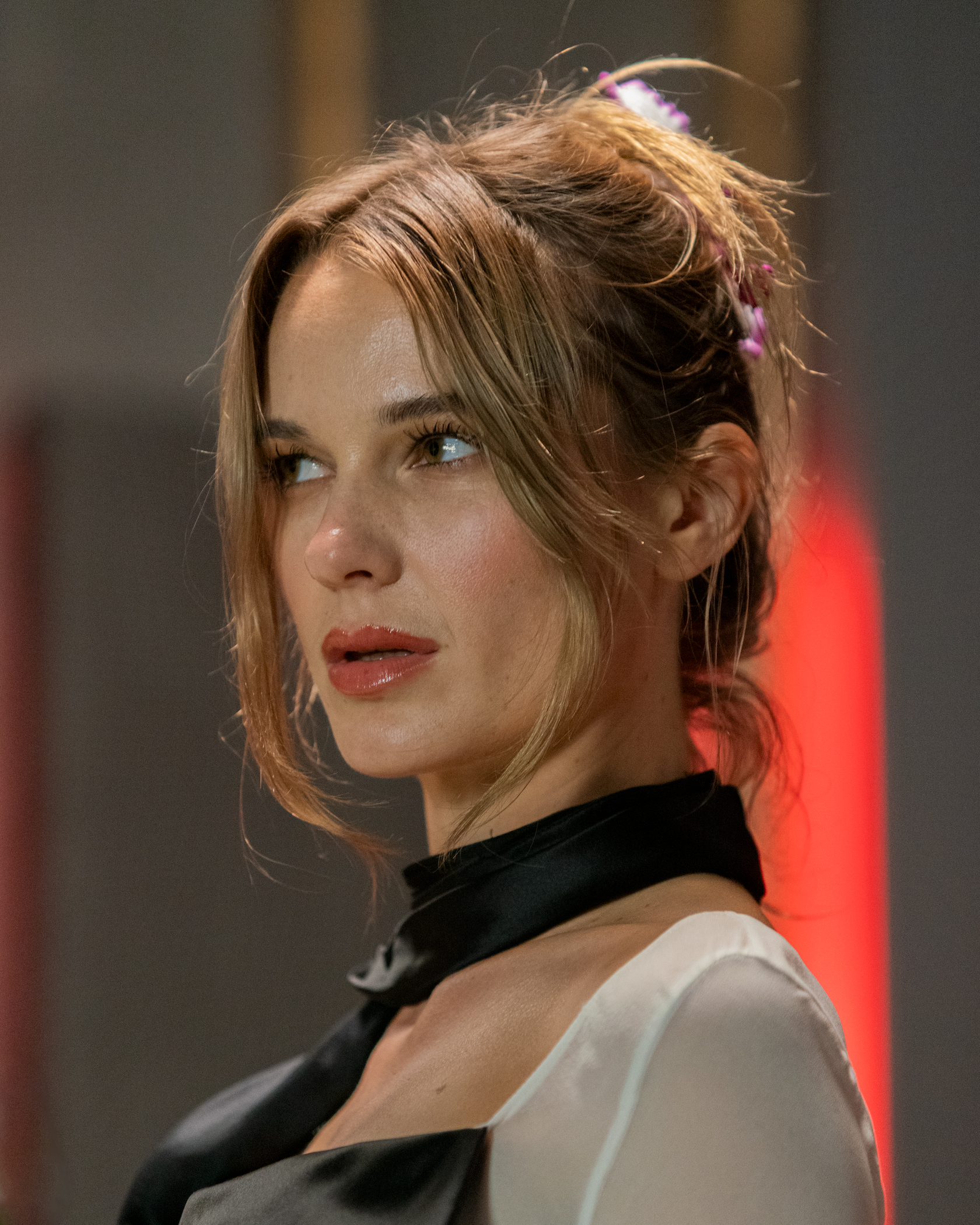 Portrait of a woman with a perplexed expression looking beyond the camera